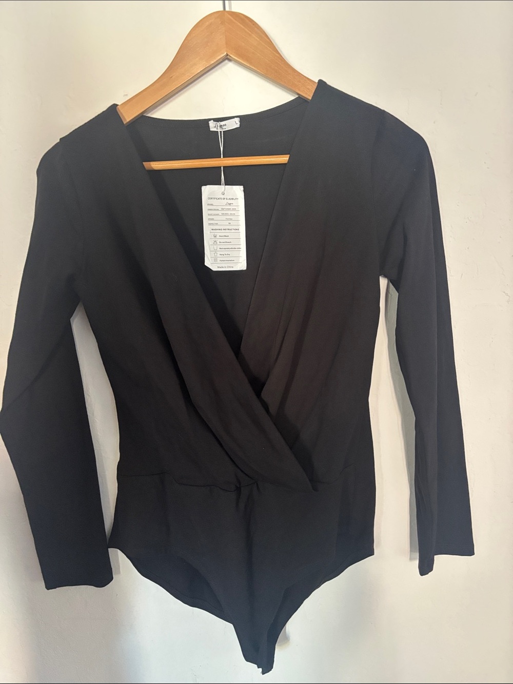 Sleek Black Wrap-Front Long Sleeve Bodysuit